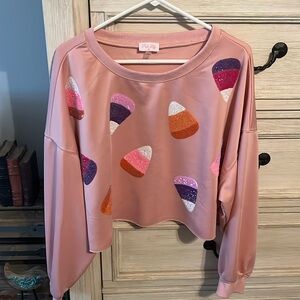Candy corn sequin crop sweatshirt from Pink Lily
